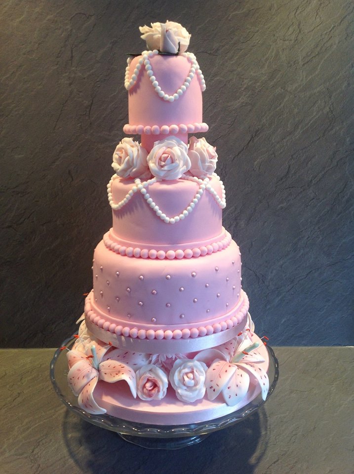 Pink 3-tier Anniversary cake with roses, lillies, and pearl details