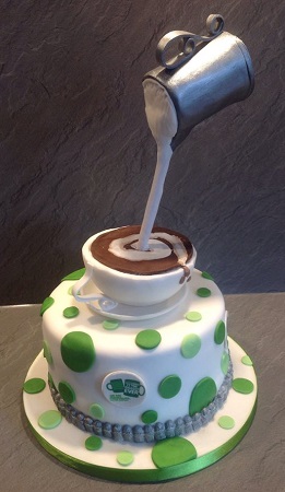Macmillan coffee morning coffee cup and pouring milk jug cake