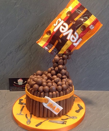 Revels pouring onto cake gravity defying cake