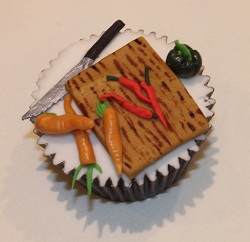 Chopping board and chillis cupcake