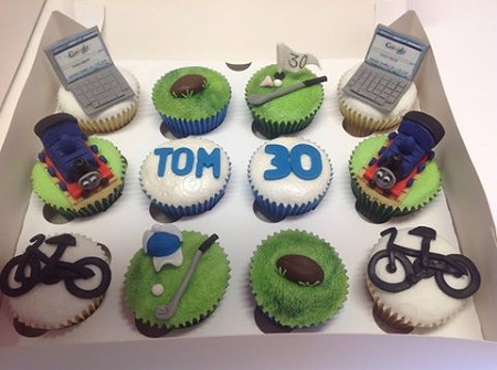 Birthday cupcakes for a man with lots of hobbies - laptop, cycling, golf, rugby and Thomas the Tank Engine