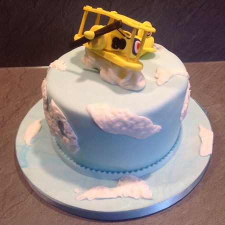 Tiger Moth plane flying over clouds birthday cake