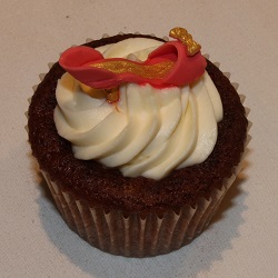 Red velvet cupcake with red and gold shoe