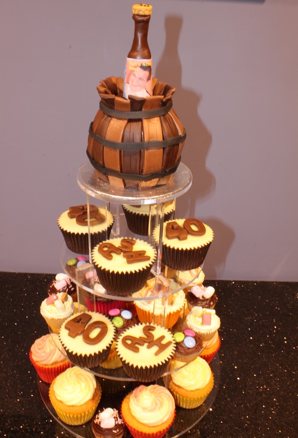 40th birthday top tier cake on top of the display stand