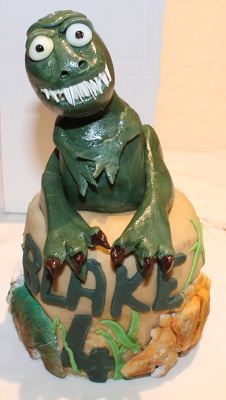 Dinosaur top tier birthday cake