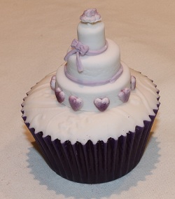 Purple hearts and bow wedding cupcake